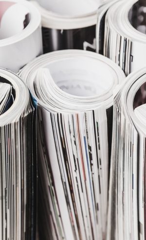 Glossy magazine with pages rolled